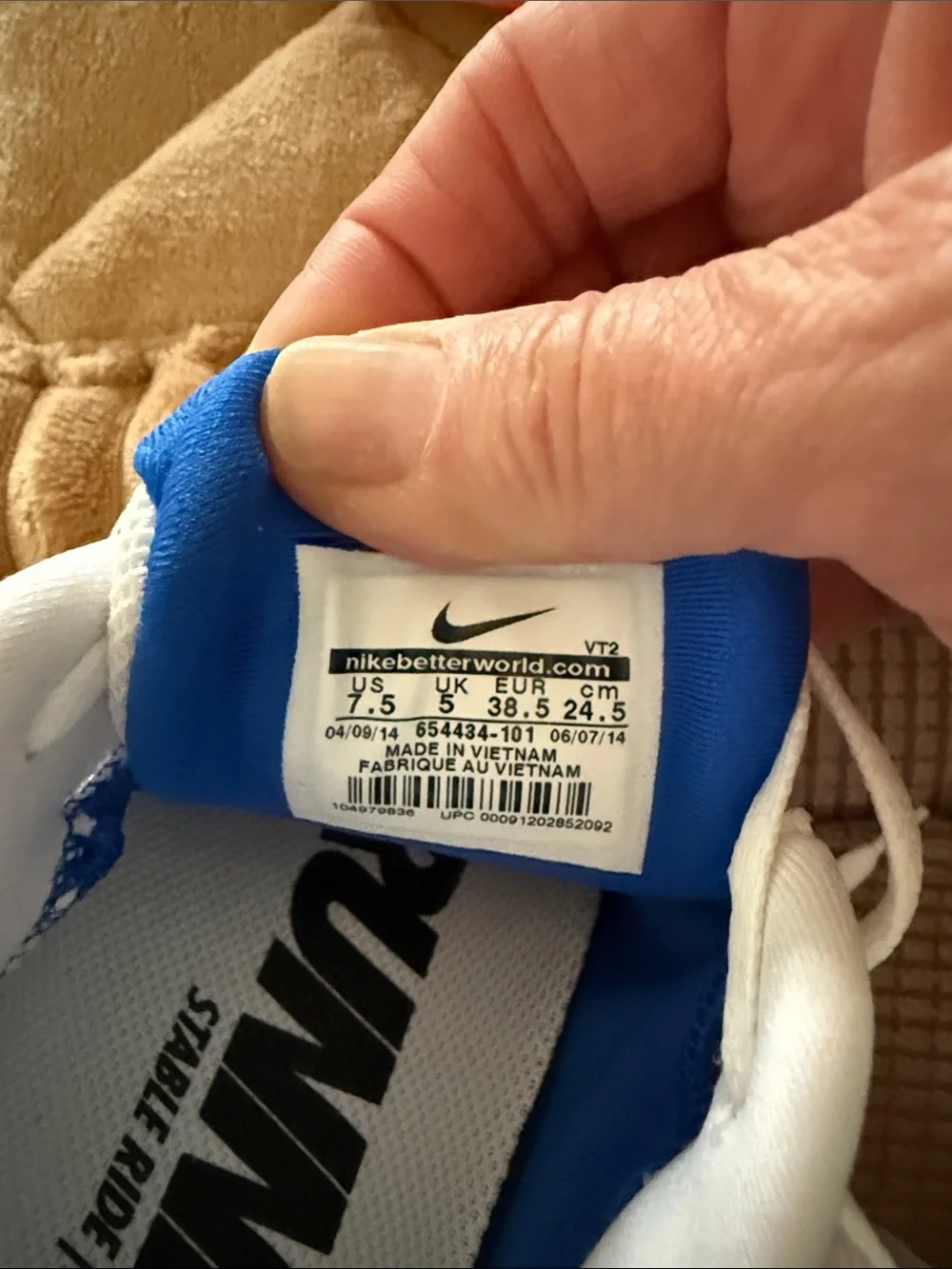 Nike Women's White Running Shoes with Blue and Pink Accents